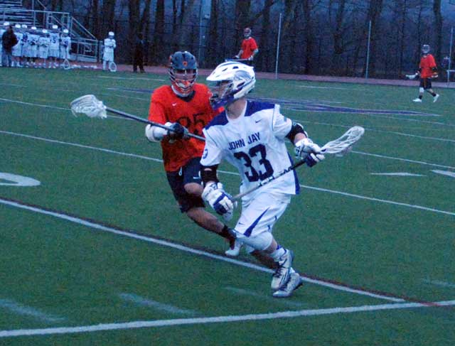 Danny Skluth goes on the attack for the John Jay boys lacrosse team during Tuesday’s loss to Manhassett at home.