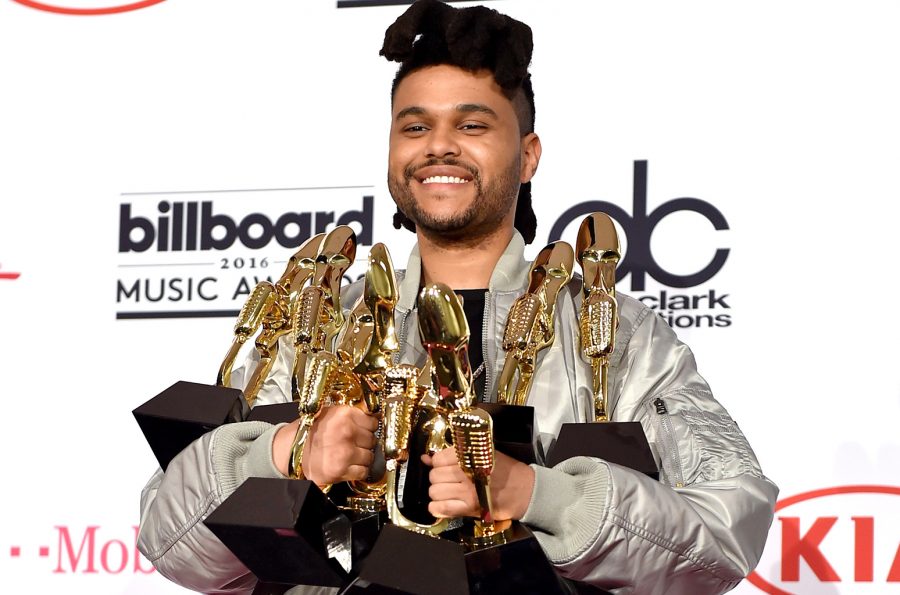 LAS VEGAS, NV - MAY 22:  Recording artist The Weeknd, winner of the Top Songs Sales Artist award, Top Radio Song award for Cant Feel My Face, Top Hot 100 Artist award, Top Radio Songs Artist award, Top Streaming Song (Audio) award for The Hills, Top R&B Artist award, and Top R&B Song award for The Hills, poses in the press room during the 2016 Billboard Music Awards at T-Mobile Arena on May 22, 2016 in Las Vegas, Nevada.  (Photo by David Becker/Getty Images)